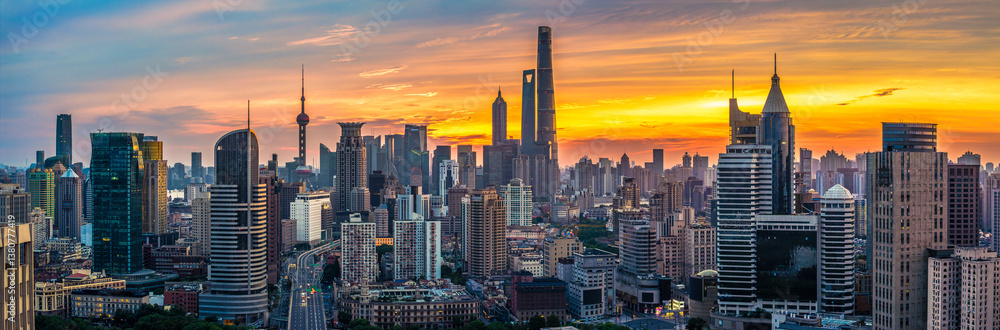 Fototapeta premium Shanghai skyline with modern skyscrapers at sunrise. Urban landscape and financial district background.