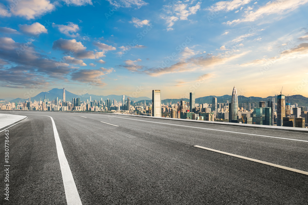 Fototapeta premium Asphalt road and city skyline with mountains in Shenzhen. Modern cityscape and road background.