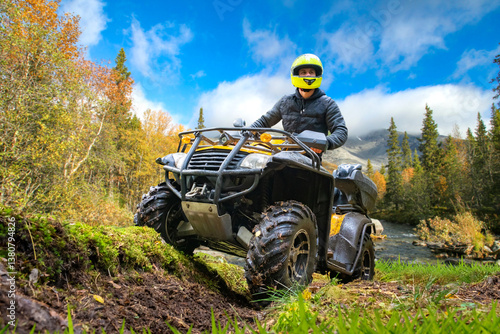 Man on quad bike. Guy on AT...
