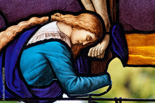 Wall Mural Stained glass (19th century) of Saint Mary Magdalene at the feet of Christ on the cross