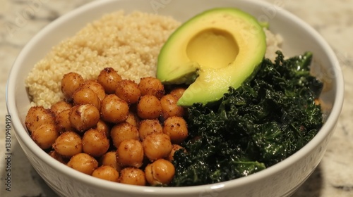 Colorful Buddha Bowl with Roasted Chickpeas, Quinoa, Avocado, and Kale Composition