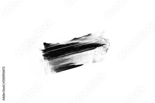 A sample of black mascara. White background