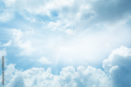 Fototapeta Naklejka Na Ścianę i Meble -  Bright rays of light in blue sky heavenly clouds