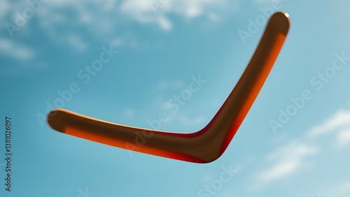 Flying wooden boomerang in motion against a clear blue sky, symbolizing outdoor fun and traditional recreation.  