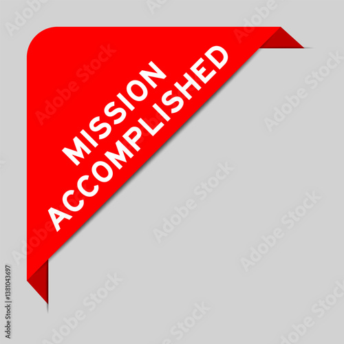 Red color of corner label banner with word mission accomplished on gray background