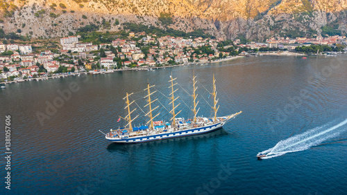 Royal Clipper a five-masted tall ship used as a cruise ship. Aerial view of the sailing ship with another small boat nearby in the adriatic sea in the Bay of Kotor, Montenegro