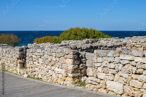 View of the ancient stone wall and the sea