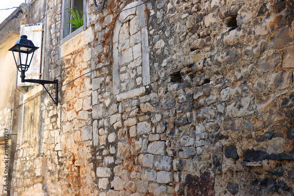 Picturesque Mediterranean street and traditional architectural details in Trogir, Croatia.