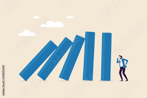 Risk management, uncertainty or unknown threat causing business failure, economic crisis, danger or problem, security and safety concept, courage businessman thinking look at collapsing domino effect.