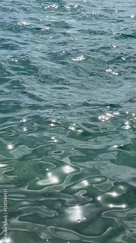 Wallpaper Mural Sunlight dances across rippling sea water, creating a hypnotic, shimmering pattern of pure summer calm. Torontodigital.ca