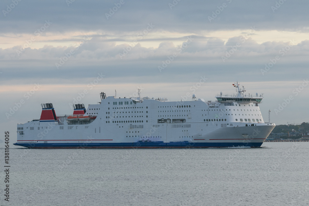 Giant luxury cruise ship at the Kiel fjord. Giant luxury cruise ship at the Kiel fjord.