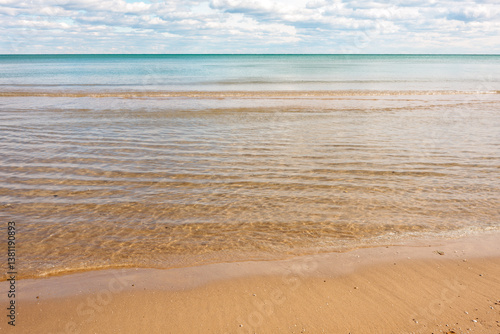 Fototapeta Naklejka Na Ścianę i Meble -  Very calm, clear water of Lake Michigan as it comes on-shore within Harrington Beach State Park, Belgium, Wisconsin in early November