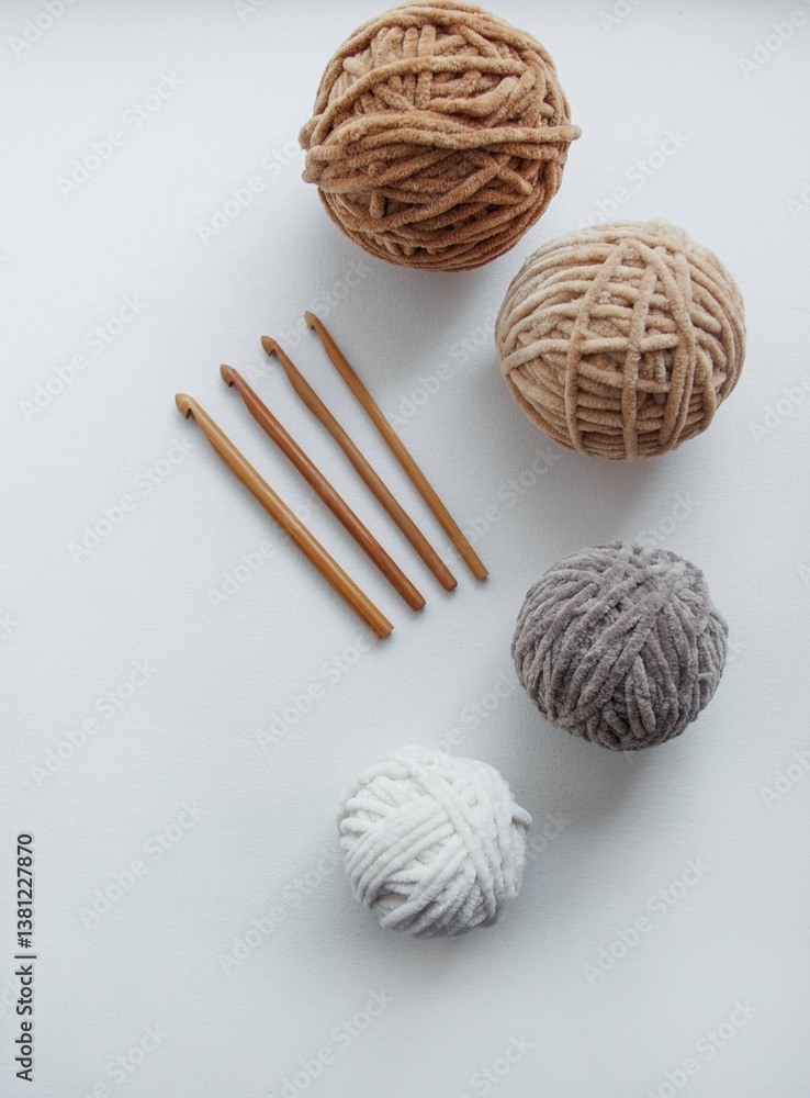 yarn balls with needles on gray background. top view yarn balls with needles on gray background. top view