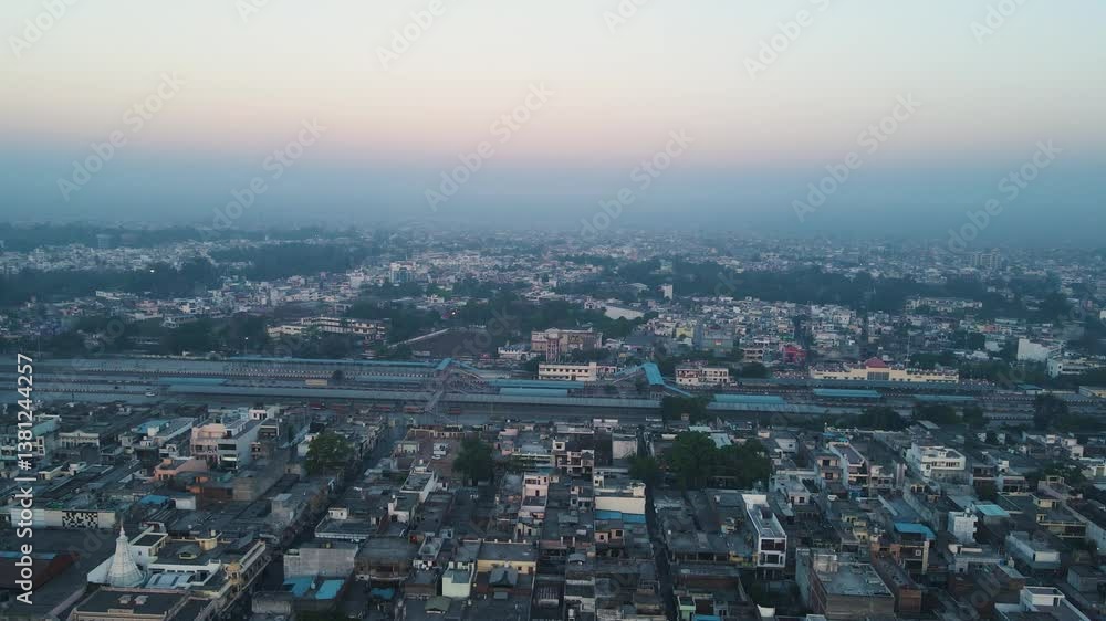Aerial drone shot displaying a panoramic view of a city, highlighting its intricate road networks, towering buildings, and vibrant city life. Aerial drone shot displaying a panoramic view of a city, highlighting its intricate road networks, towering buildings, and vibrant city life.