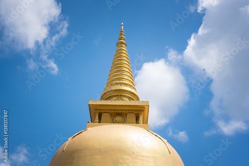 Giant gold-plated Buddha statue in a Buddhist temple in Dambulla, Sri Lanka. 