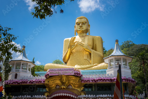 Giant gold-plated Buddha statue in a Buddhist temple in Dambulla, Sri Lanka. 