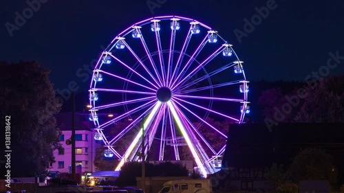Time lapse, Ferris wheel at night. Observation wheel in european town. Schlieren, Dietikon, canton of Zürich in Switzerland.