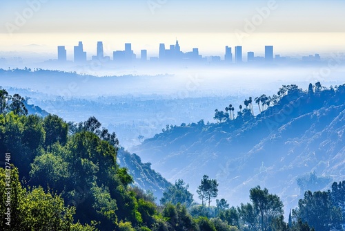 A thick blanket of smog and haze from a nearby wildfire hides the view of downtown Los Angeles buildings, taken from a hilltop in Griffith Park, Southern California
