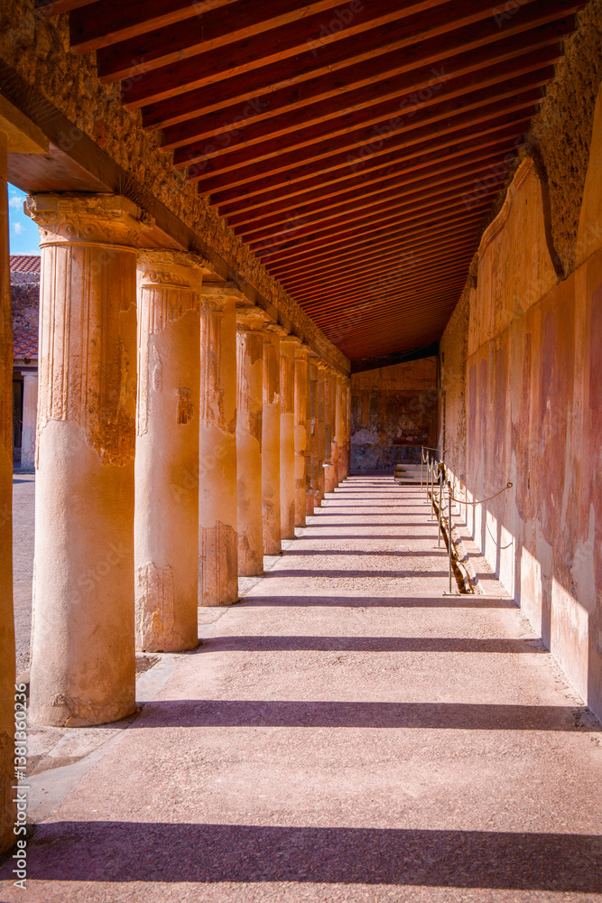 Architectural columns in the ancient city of Pompeii, Italy: light and shadow, and abstract geometry Architectural columns in the ancient city of Pompeii, Italy: light and shadow, and abstract geometry