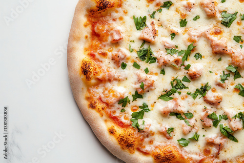 Close up view of New York style pizza topped with herbs and chicken on a white background photo