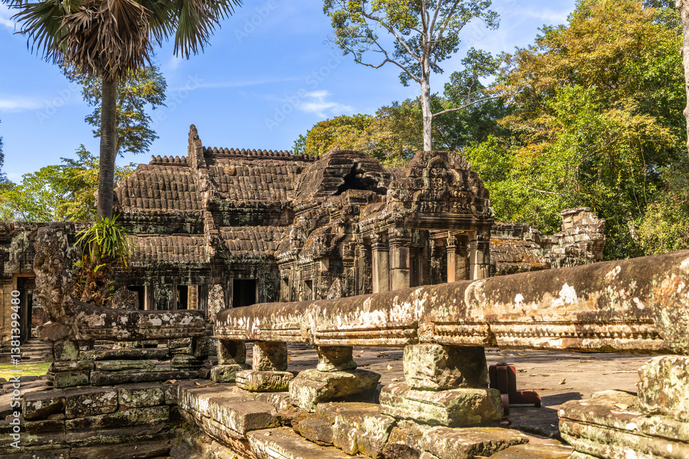 Fototapeta premium Ancient Hindu temple ruins of Banteay Kdei, adorned with statues, Angkor Archaeological Park, Siem Reap, Cambodia