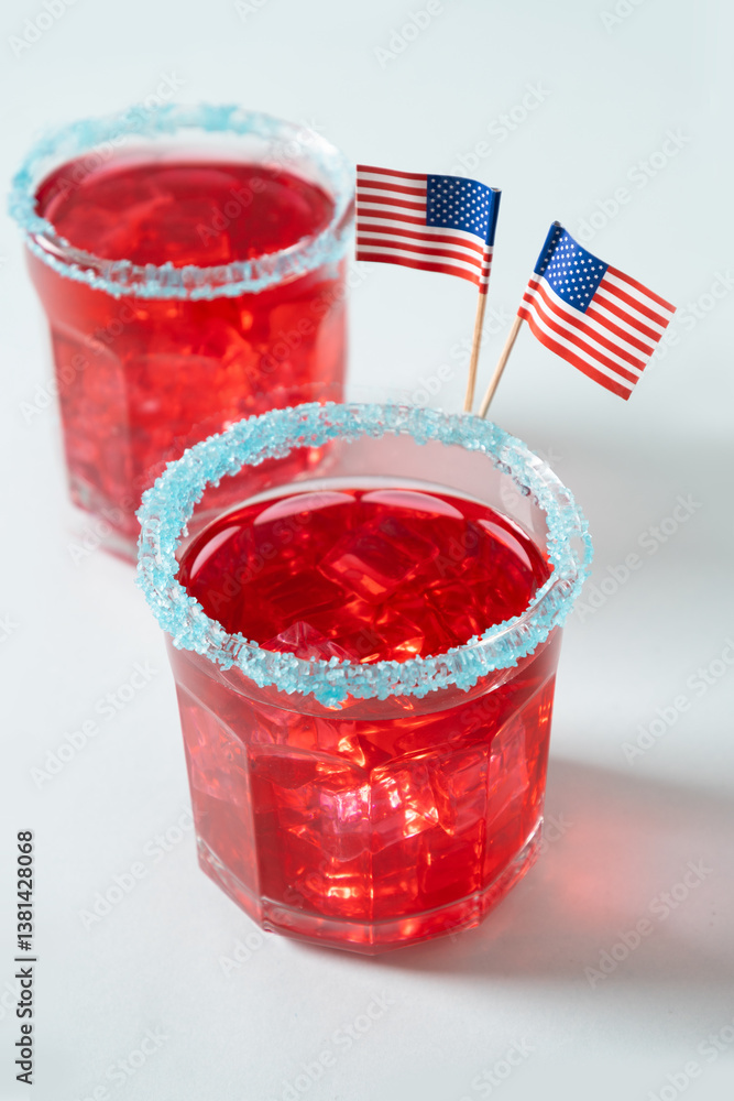 Independence Day of July 4th. Celebratory red margarita in glasses on gray background. Vertical format. Close up.
