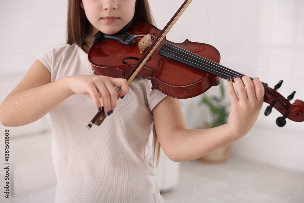Teenage girl playing violin at music lesson, closeup Teenage girl playing violin at music lesson, closeup