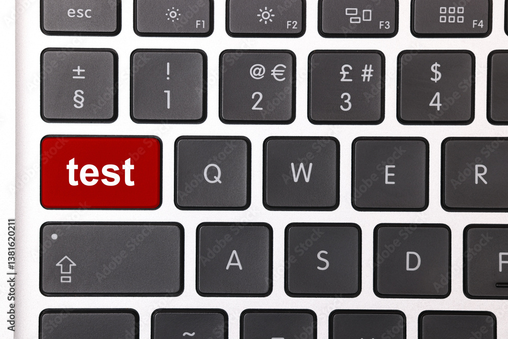 Online test. Laptop keyboard with word on red button, closeup Online test. Laptop keyboard with word on red button, closeup