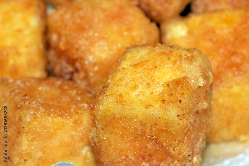 Close up of Square Cooked Crispy Fried Battered Tofu Soy Close up of Square Cooked Crispy Fried Battered Tofu Soy