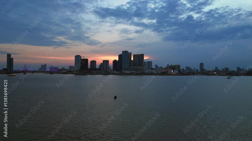 Cambodia City sunset skyline on Mekong River. Majestic aerial view flight drone Cambodia City sunset skyline on Mekong River. Majestic aerial view flight drone
