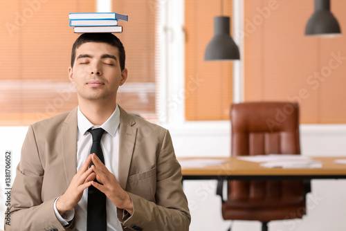 Young businessman with book...