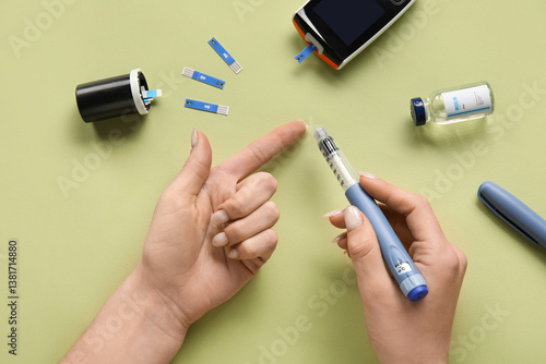 Diabetic woman using lancet...