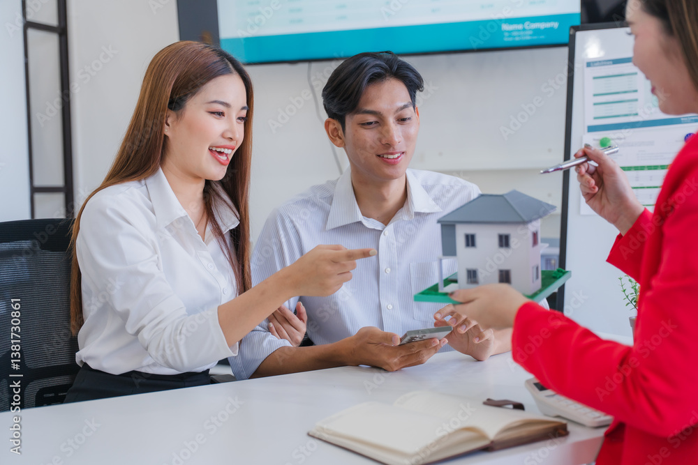 Fototapeta premium Couple Buying New House with Agent