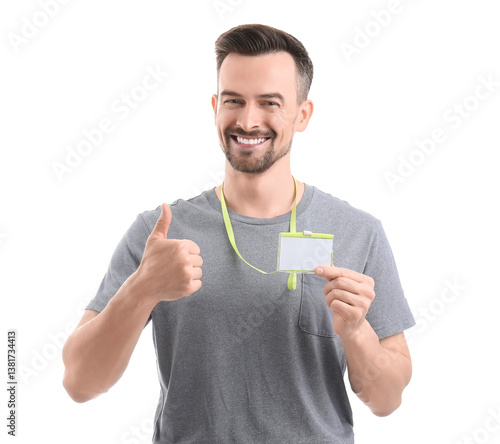 Young man with blank badge ...