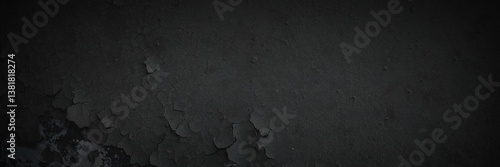 Dark wide panoramic background. Peeling paint on a concrete wall. Dark grunge texture of old cracked flaking paint. Weathered rough painted surface. Patterns of cracks. Darkness background for design.