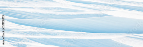 Obraz na płótnie Snow texture. Wind sculpted patterns on snow surface. Wind in the tundra and in the mountains on the surface of the snow sculpts patterns and ridges (sastrugi). Arctic, Polar region. Winter background w salonie