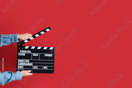 Female hands with movie cla...
