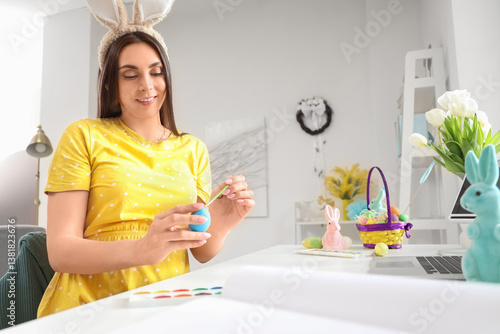 Young woman in bunny ears p...
