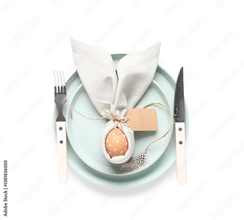 Beautiful table setting with Easter egg and feather on white background