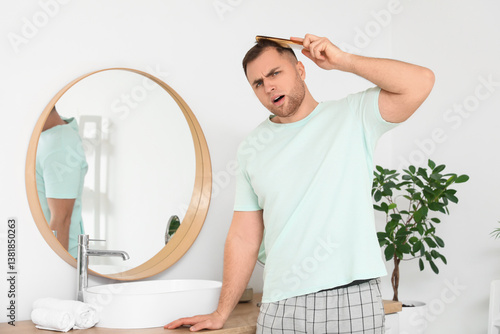 Worried young man with hair...