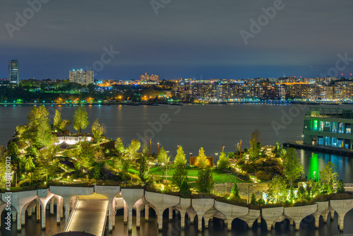 2021-10-28 THE NEW JERSEY SKYLINE AND LITTLE ISLAND FROM MANHATTAN AT NIGHT WITH A NICE GLOW IN HTE PARK AND BRIGHT BUILDINGS
