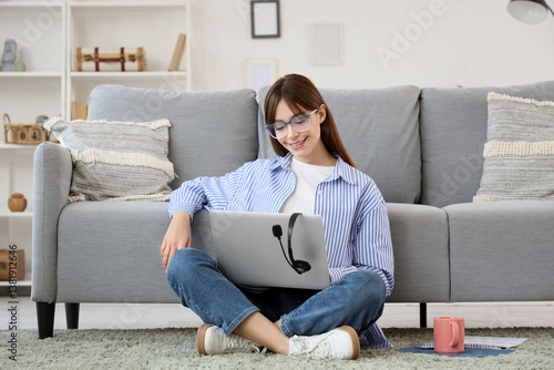 Teenage girl with laptop wo...