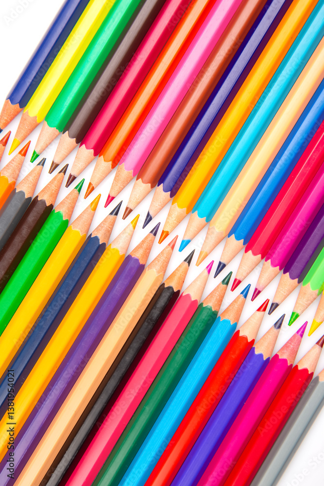 A rainbow of colored pencils stacked in a grid formation on a white background. Perfect for promoting creativity, school essentials, or art-related content. A rainbow of colored pencils stacked in a grid formation on a white background. Perfect for promoting creativity, school essentials, or art-related content.