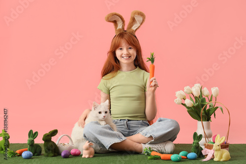 Smiling redhead girl with b...