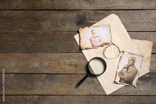 Obraz na płótnie Old photos of relatives with letter and magnifier on wooden background with space for text. Concept of family tree w salonie