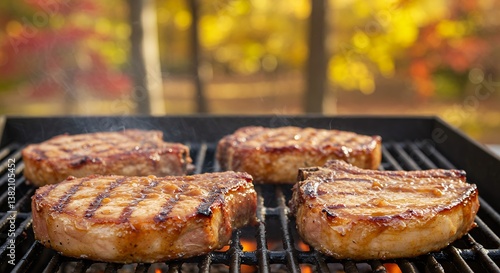 Pork Chops Cooking on Grill with Autumn Leaves Background
