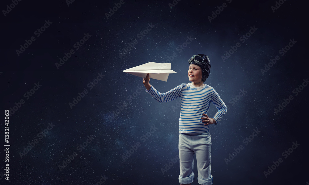 Happy kid playing with paper airplane