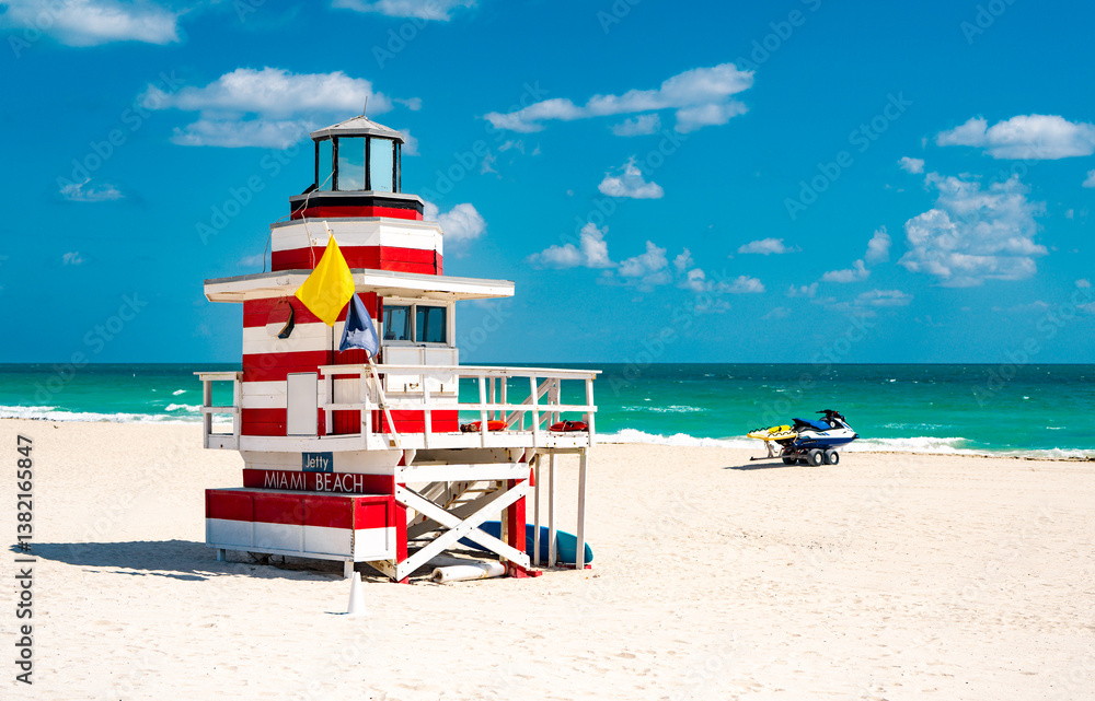 Fototapeta premium Beauty beach in Miami. Lifeguard tower on South Miami Beach. Miami Beach coastline. Famous Beach lifeguard. Travel to Miami. Art Deco lifeguard on Miamis shoreline.