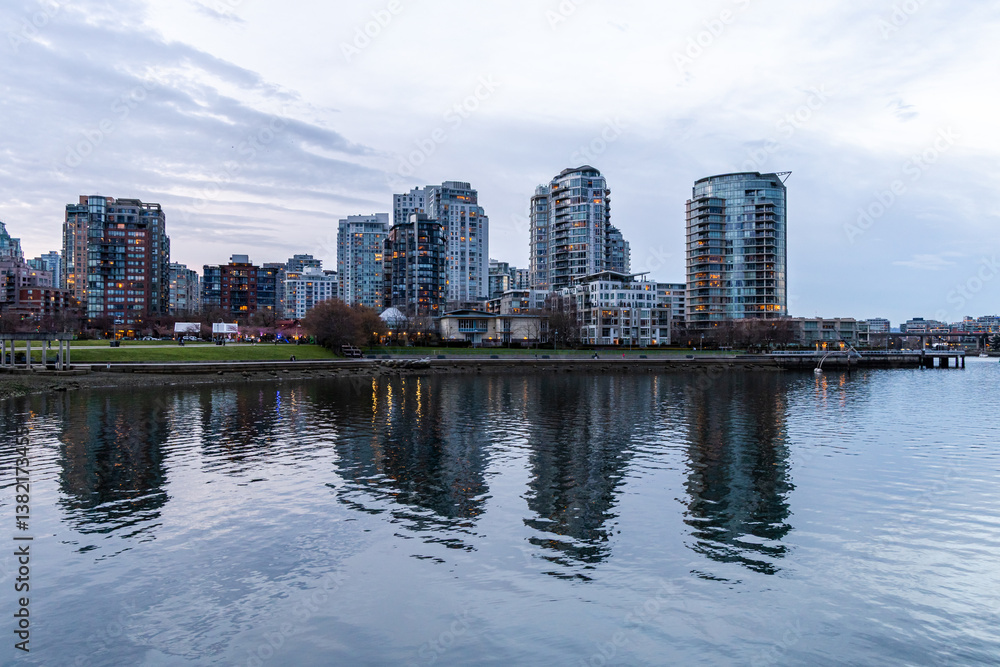 Naklejka premium Downtown Vancouver Skyline by the Waterfront During Dusk With Reflections in Water