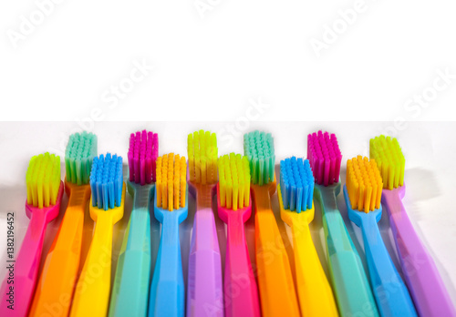 A set of multicolored toothbrushes isolated on white background. Design concept for dental and oral health theme.